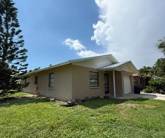 a view of a house with a garden