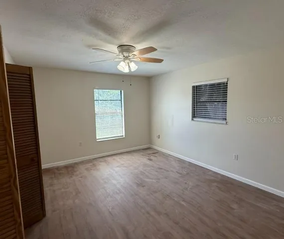 a view of an empty room with a window