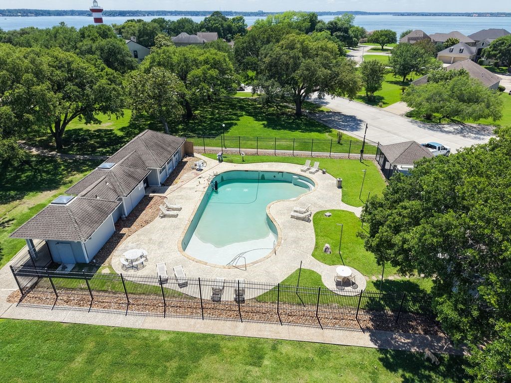 1607 Schooner Point Willis, TX 77318 - Photo 38 of 47 Harbour Town community pool. Notice the area landmark red/white Lighthouse.
