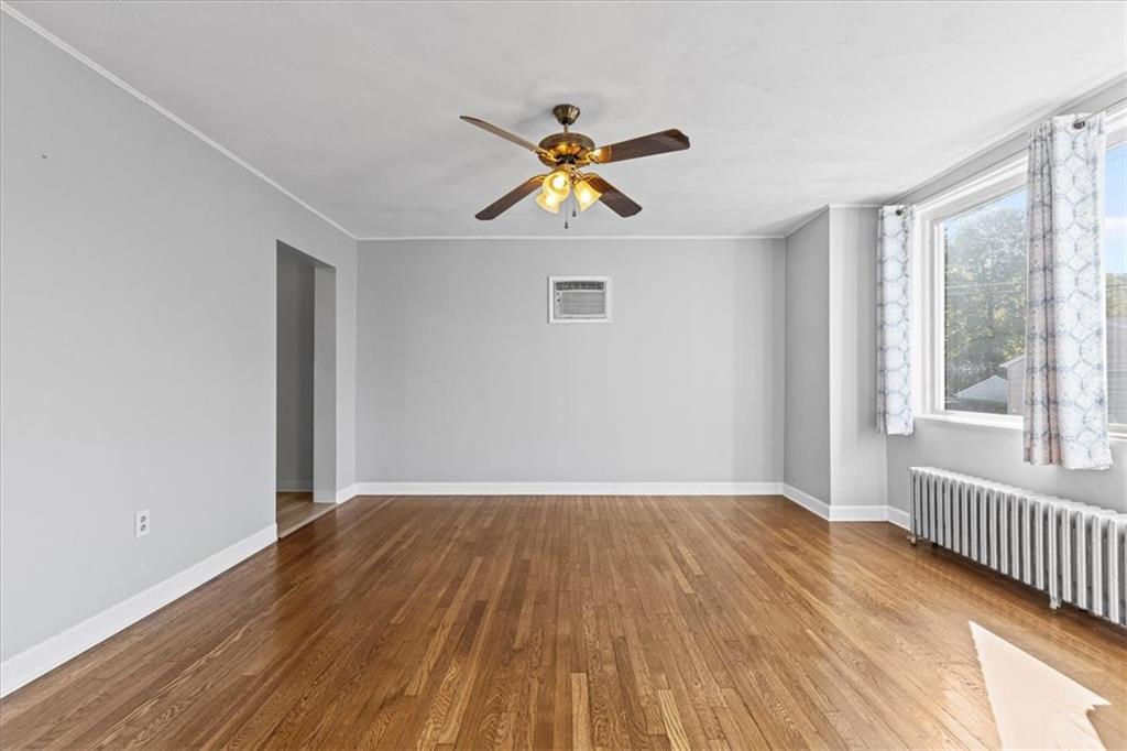 533 Wilson Avenue Rochester, PA 15074 - Photo 8 of 34 a view of empty room with wooden floor and fan