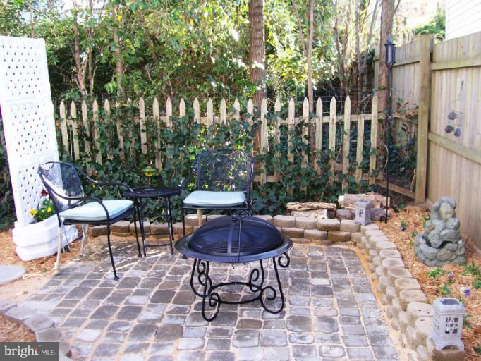 1544 Elm Road St. Leonard, MD 20685 - Photo 11 of 17 a view of a chairs and table in backyard
