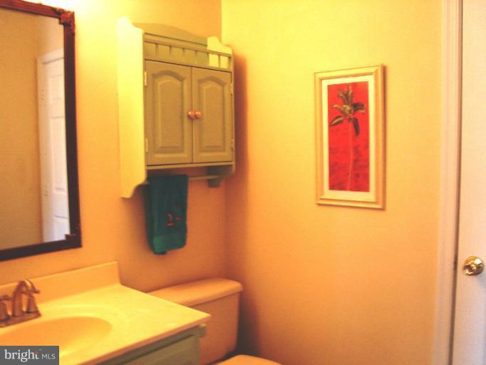 1544 Elm Road St. Leonard, MD 20685 - Photo 4 of 17 a bathroom with a sink and a mirror