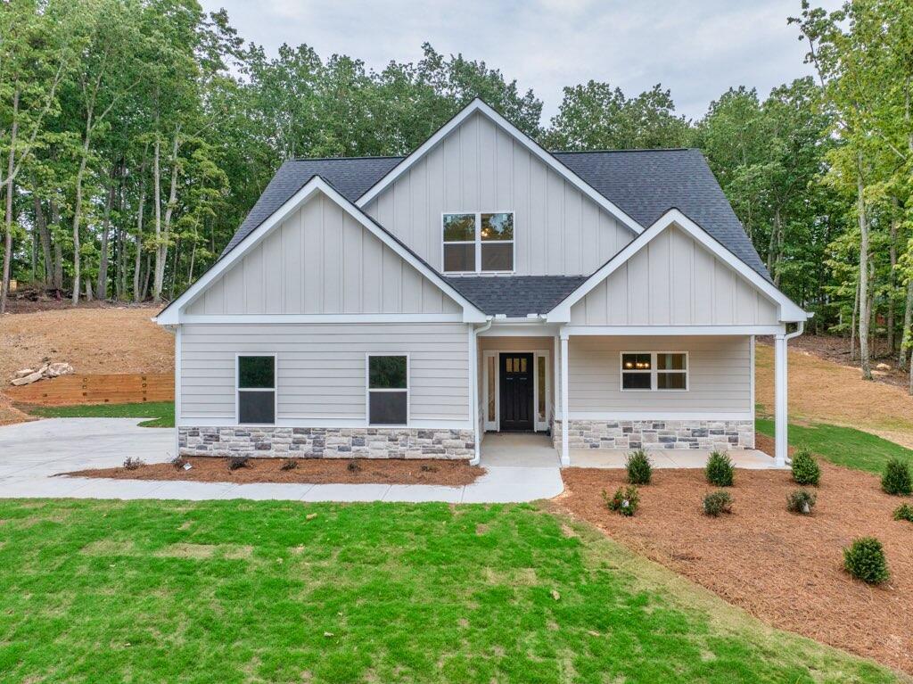 565 Mark Trail Monroe, GA 30655 - Photo 1 of 1 a front view of house with yard and trees in the background