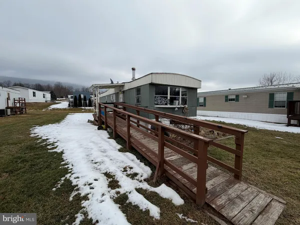a house view with a backyard space