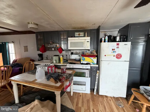 a living room with furniture a rug and a flat screen tv