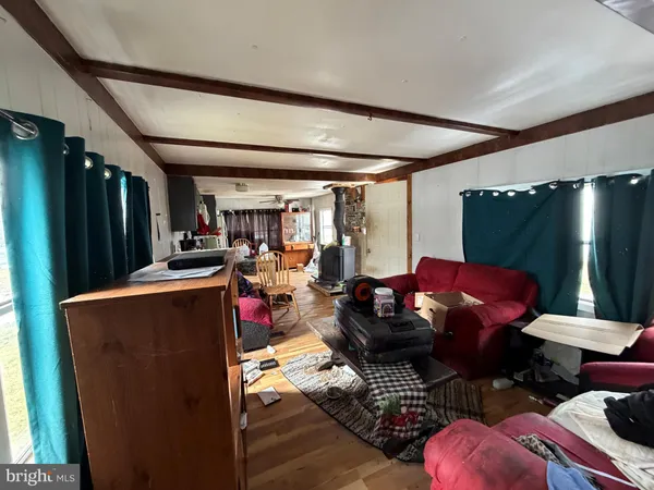 a living room with a couch and a stove top oven