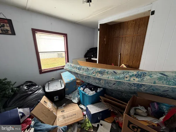 a living room with furniture and a mirror