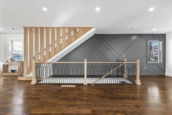 a view of entryway and hall with wooden floor