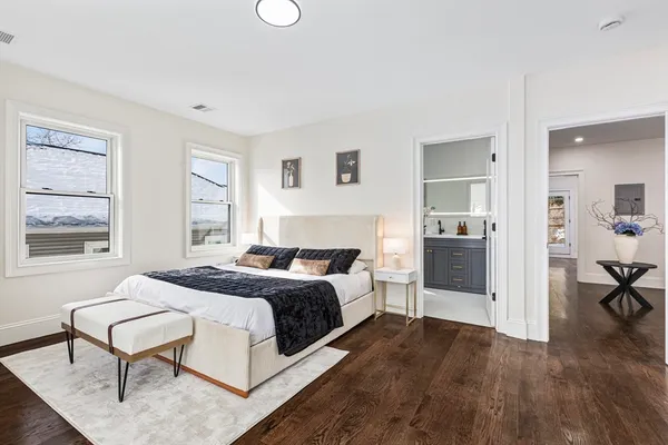 a view of a bedroom with a furniture and a bedroom