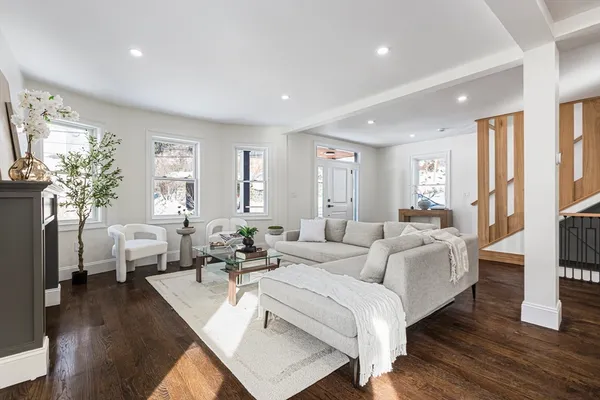 a living room with furniture or couch and a large window