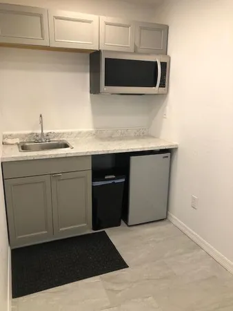 a kitchen with a sink and cabinets