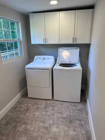 a utility room with washer and dryer