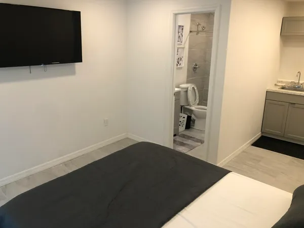 a view of a hallway to a bedroom