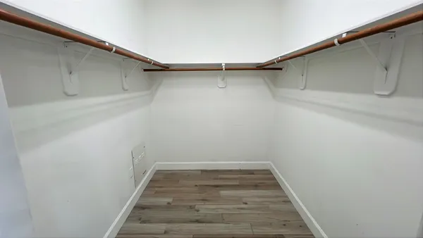 a view of an empty walk in closet