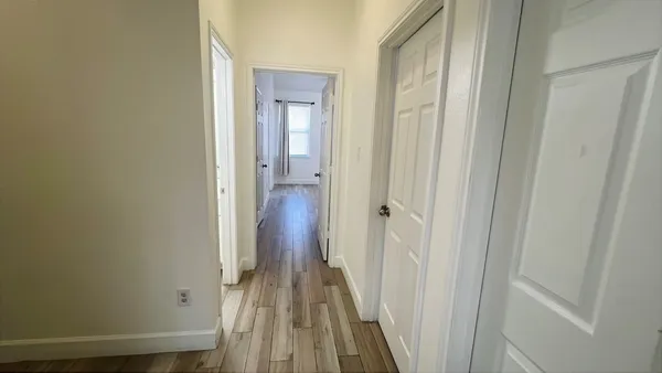 a view of a bathroom from the hallway