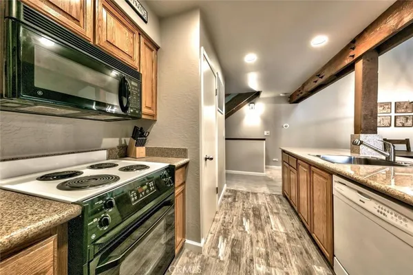a kitchen with a stove and a microwave