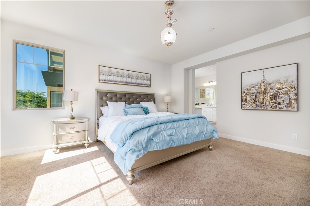 126 Interval Irvine, CA 92618 - Photo 18 of 47 a bedroom with a large bed and a window