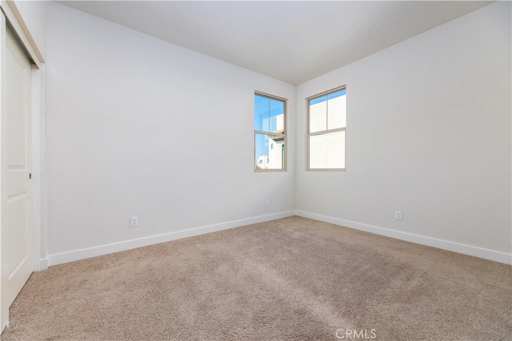 126 Interval Irvine, CA 92618 - Photo 25 of 47 an empty room with windows