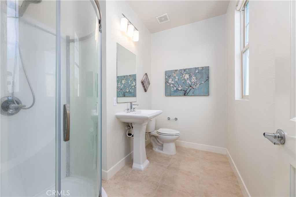 126 Interval Irvine, CA 92618 - Photo 28 of 47 a bathroom with a toilet sink and shower