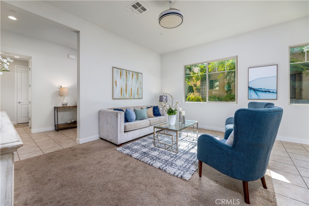 126 Interval Irvine, CA 92618 - Photo 8 of 47 a living room with furniture and a large window