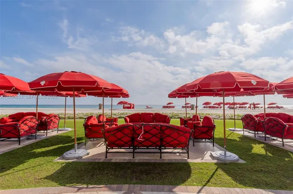 a front view of multi story residential apartment building with an outdoor space