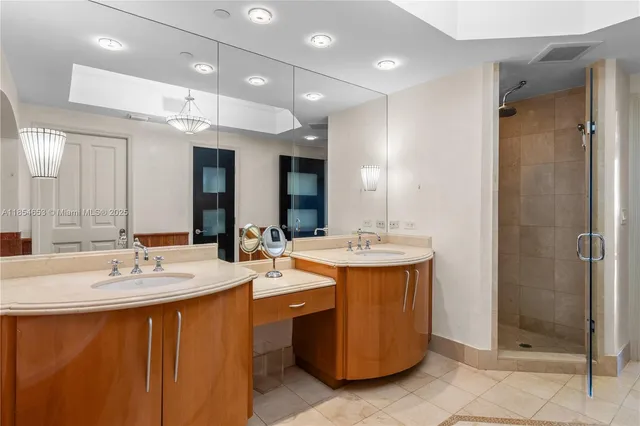 a spacious bedroom with a bed and a flat screen tv