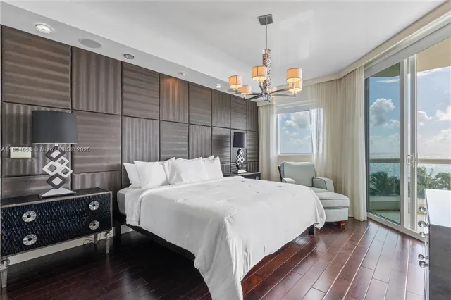 a kitchen with refrigerator and cabinets