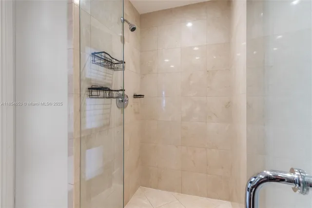a utility room with cabinets washer and dryer