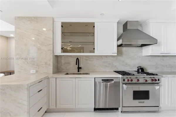 a bathroom with a sink a toilet a mirror and vanity