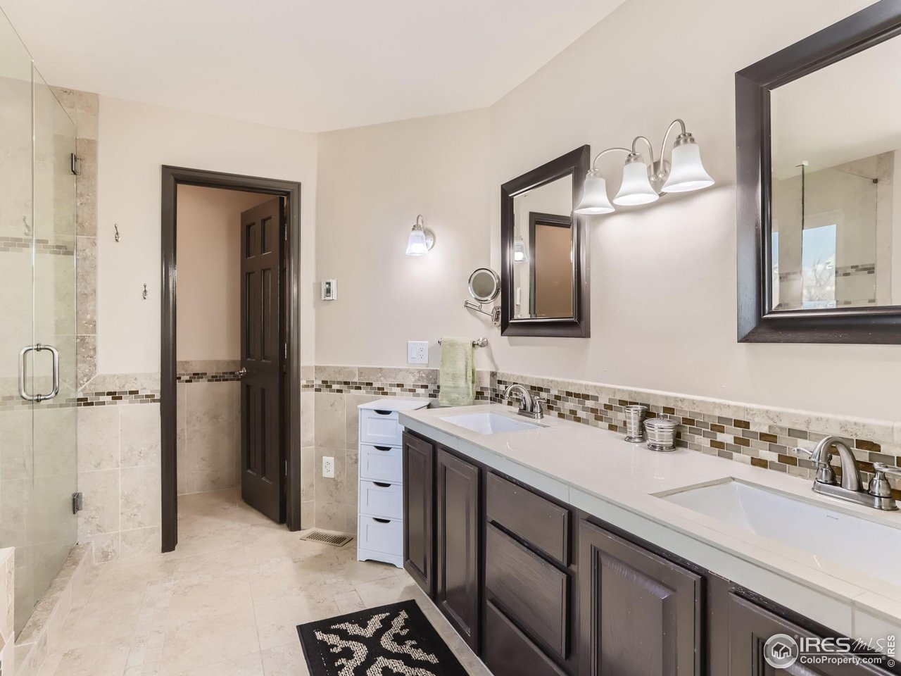 1752 Eldorado Drive Superior, CO 80027 - Photo 17 of 34 a bathroom with a sink and a mirror