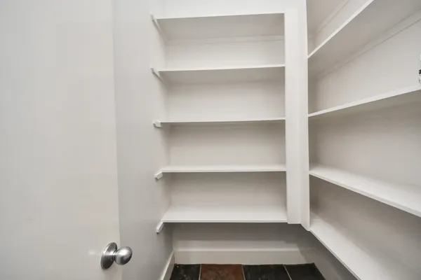 a view of an entryway with wooden floors