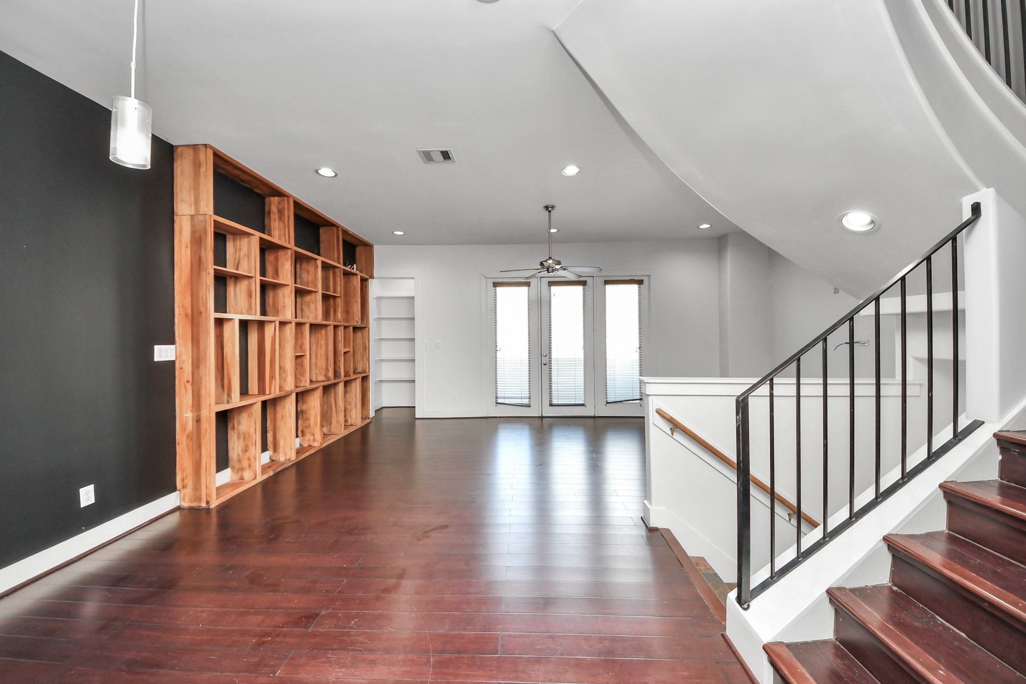 2911 Chartres Street Houston, TX 77004 - Photo 37 of 37 a view of an empty room with wooden floor and staircase