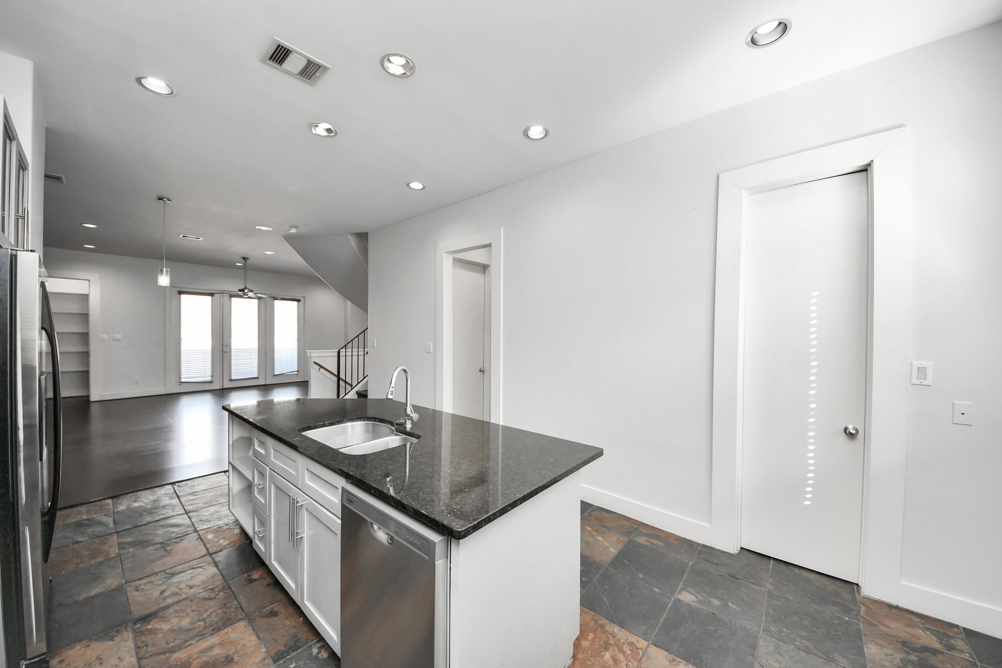 2911 Chartres Street Houston, TX 77004 - Photo 20 of 37 a kitchen with a sink and chandelier