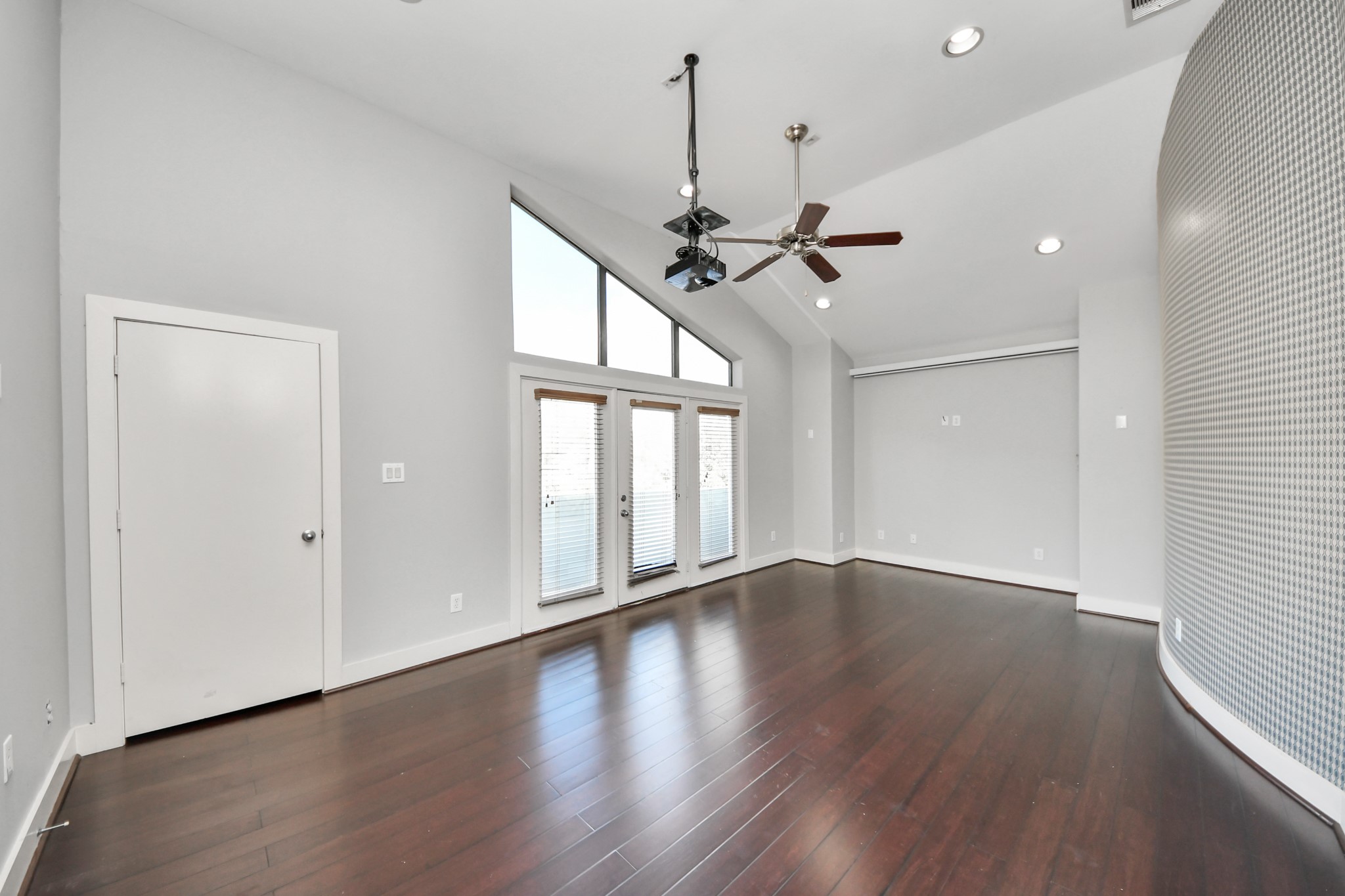 2911 Chartres Street Houston, TX 77004 - Photo 24 of 37 a view of an empty room with wooden floor and a window