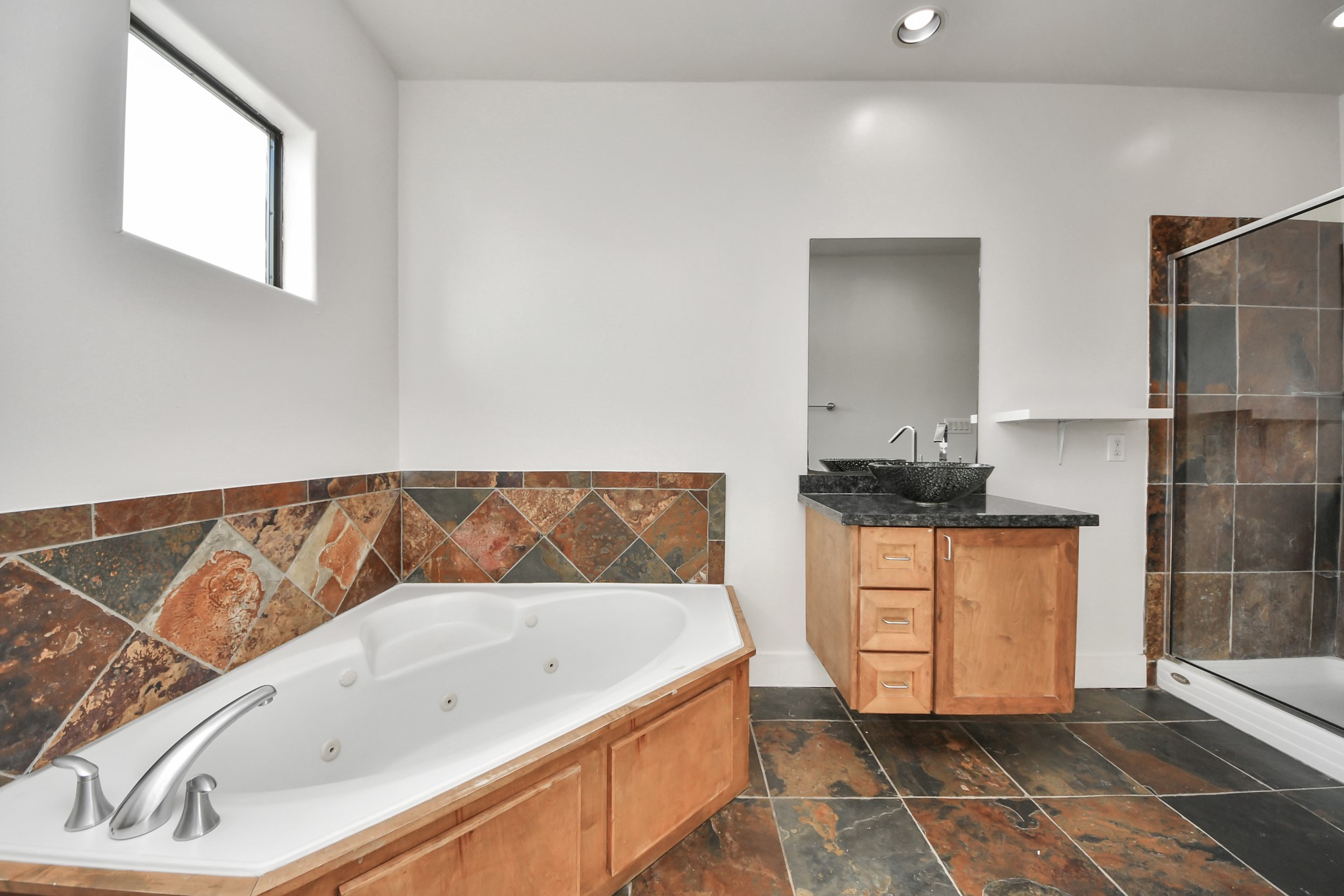 2911 Chartres Street Houston, TX 77004 - Photo 29 of 37 a bathroom with a bathtub and a sink