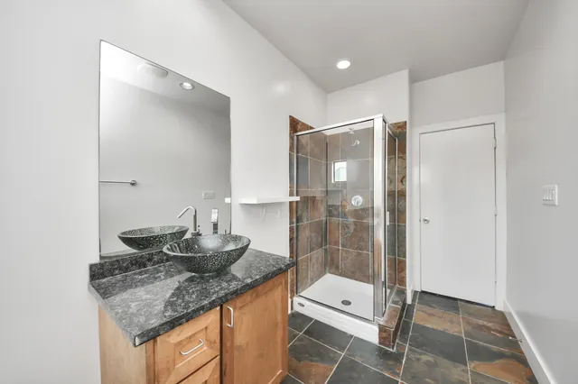 a bathroom with a bathtub and a sink