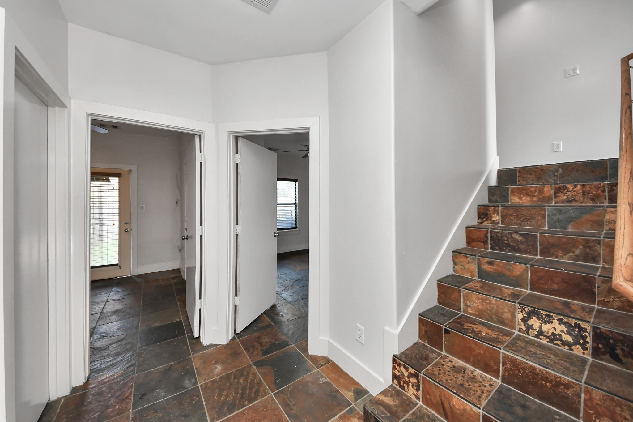 2911 Chartres Street Houston, TX 77004 - Photo 7 of 37 a view of an entryway with wooden floor and a bathroom