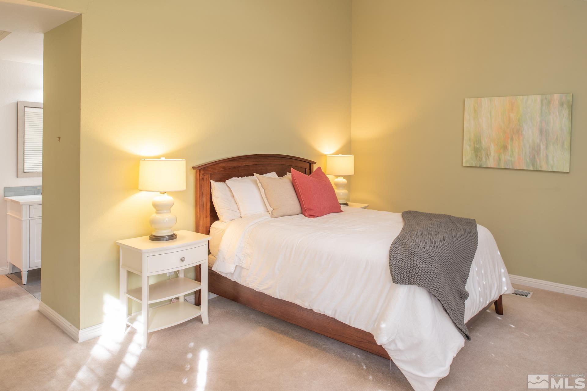 6328 Windy Meadow Drive Reno, NV 89519 - Photo 12 of 35 a bedroom with a bed and a lamp with window