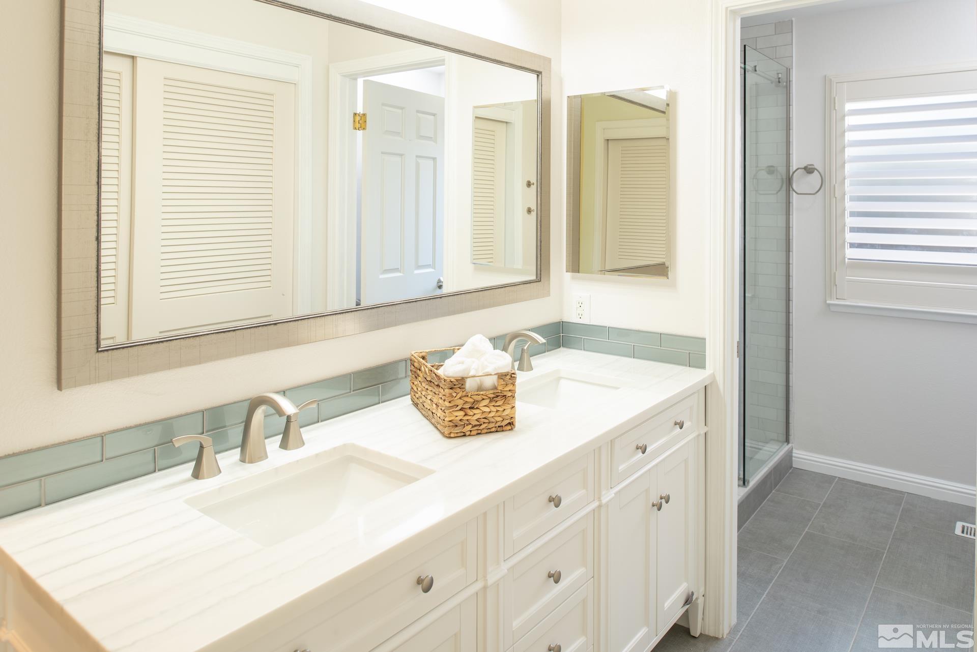 6328 Windy Meadow Drive Reno, NV 89519 - Photo 13 of 35 a bathroom with a sink and a mirror