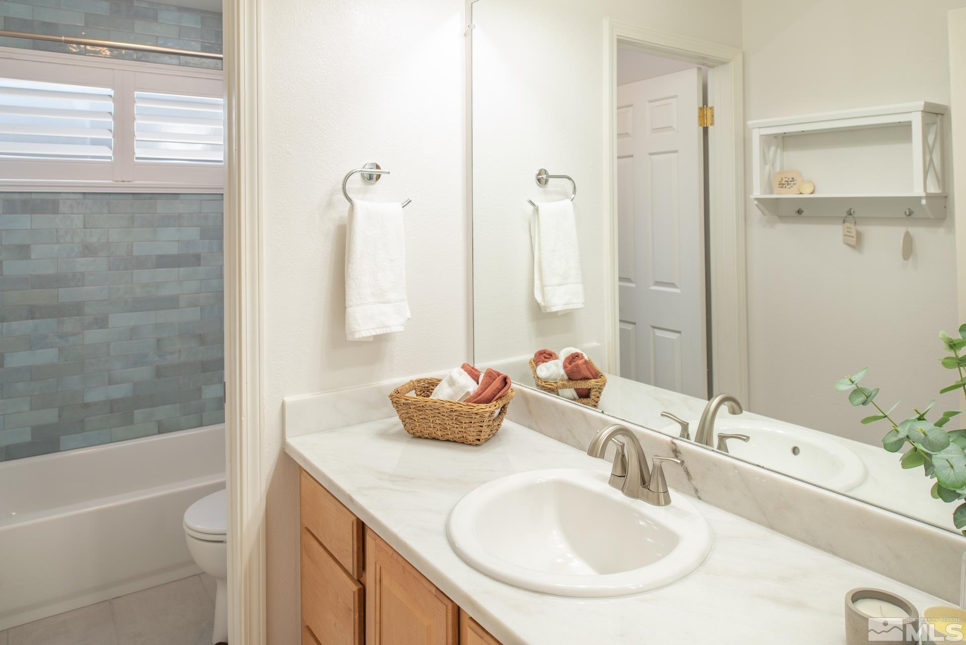 6328 Windy Meadow Drive Reno, NV 89519 - Photo 16 of 35 a bathroom with a sink and a mirror