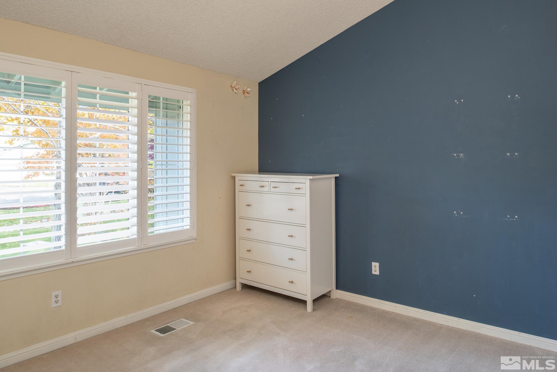 6328 Windy Meadow Drive Reno, NV 89519 - Photo 18 of 35 a view of an empty room with a window