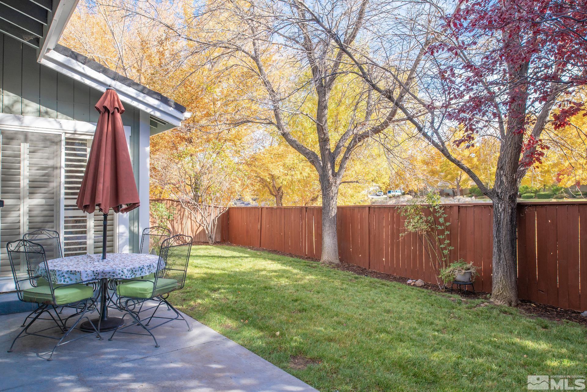 6328 Windy Meadow Drive Reno, NV 89519 - Photo 19 of 35 a backyard of a house with table and chairs