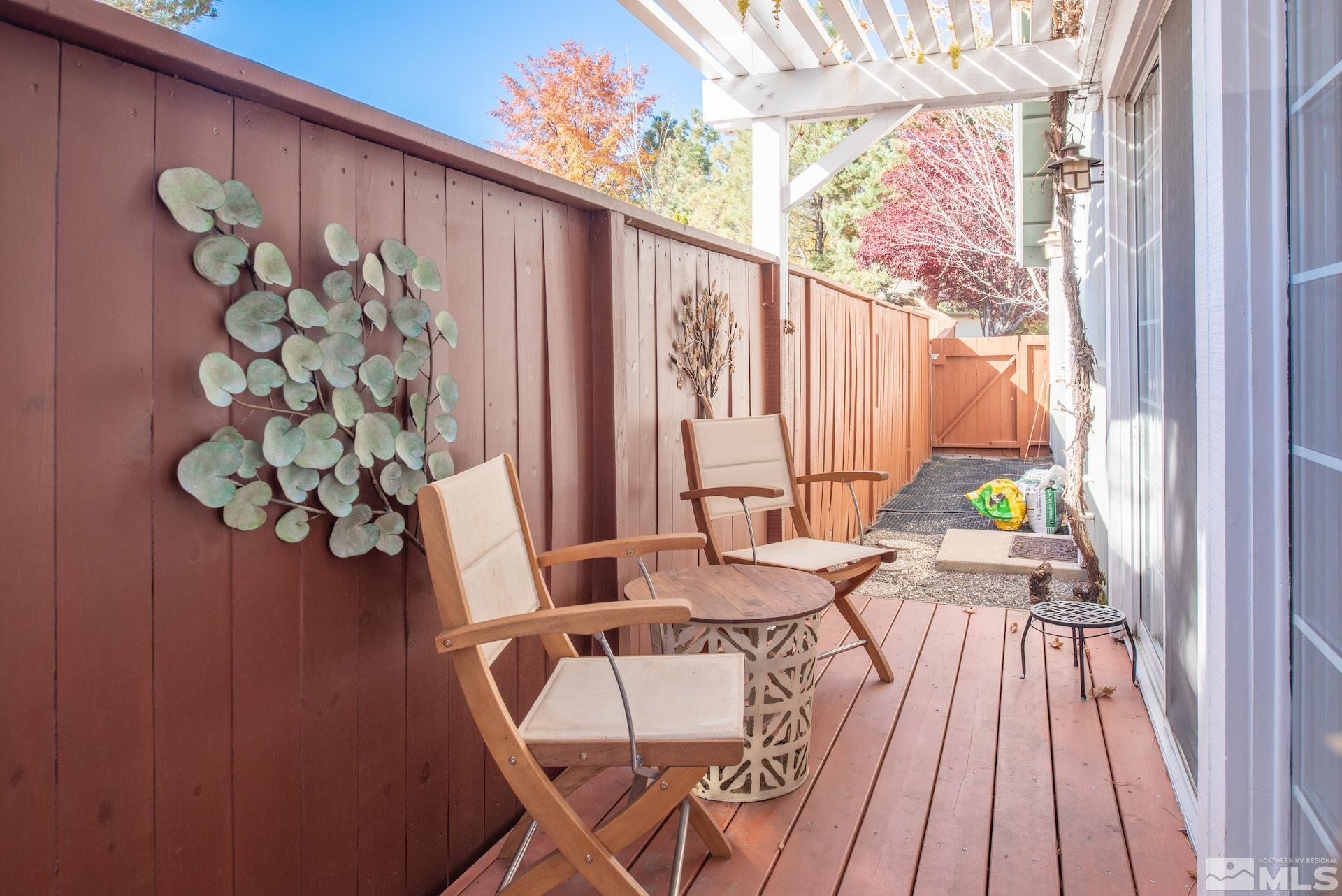 6328 Windy Meadow Drive Reno, NV 89519 - Photo 2 of 35 a view of balcony with wooden floor and outdoor seating