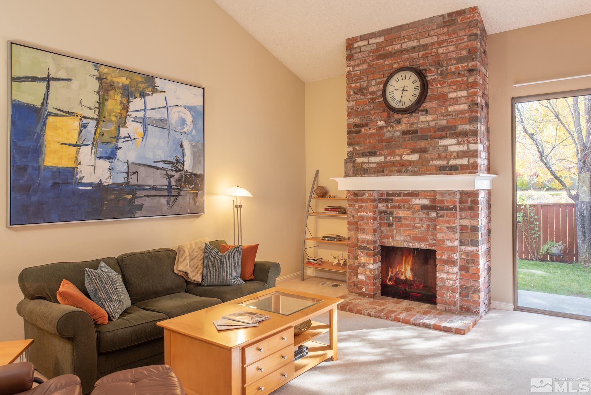6328 Windy Meadow Drive Reno, NV 89519 - Photo 3 of 35 a living room with furniture and a fireplace