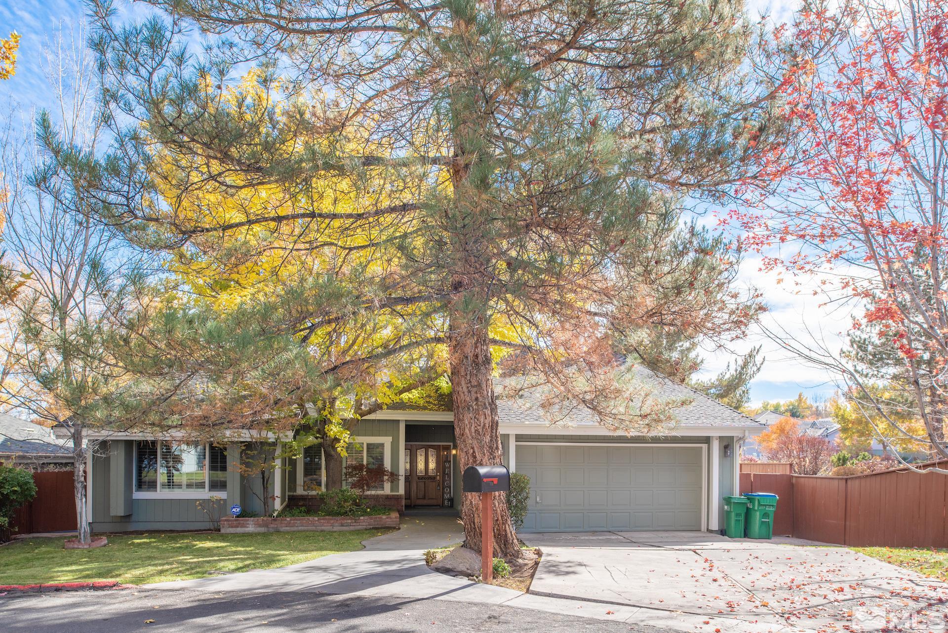 6328 Windy Meadow Drive Reno, NV 89519 - Photo 32 of 35 a front view of a house with a garden