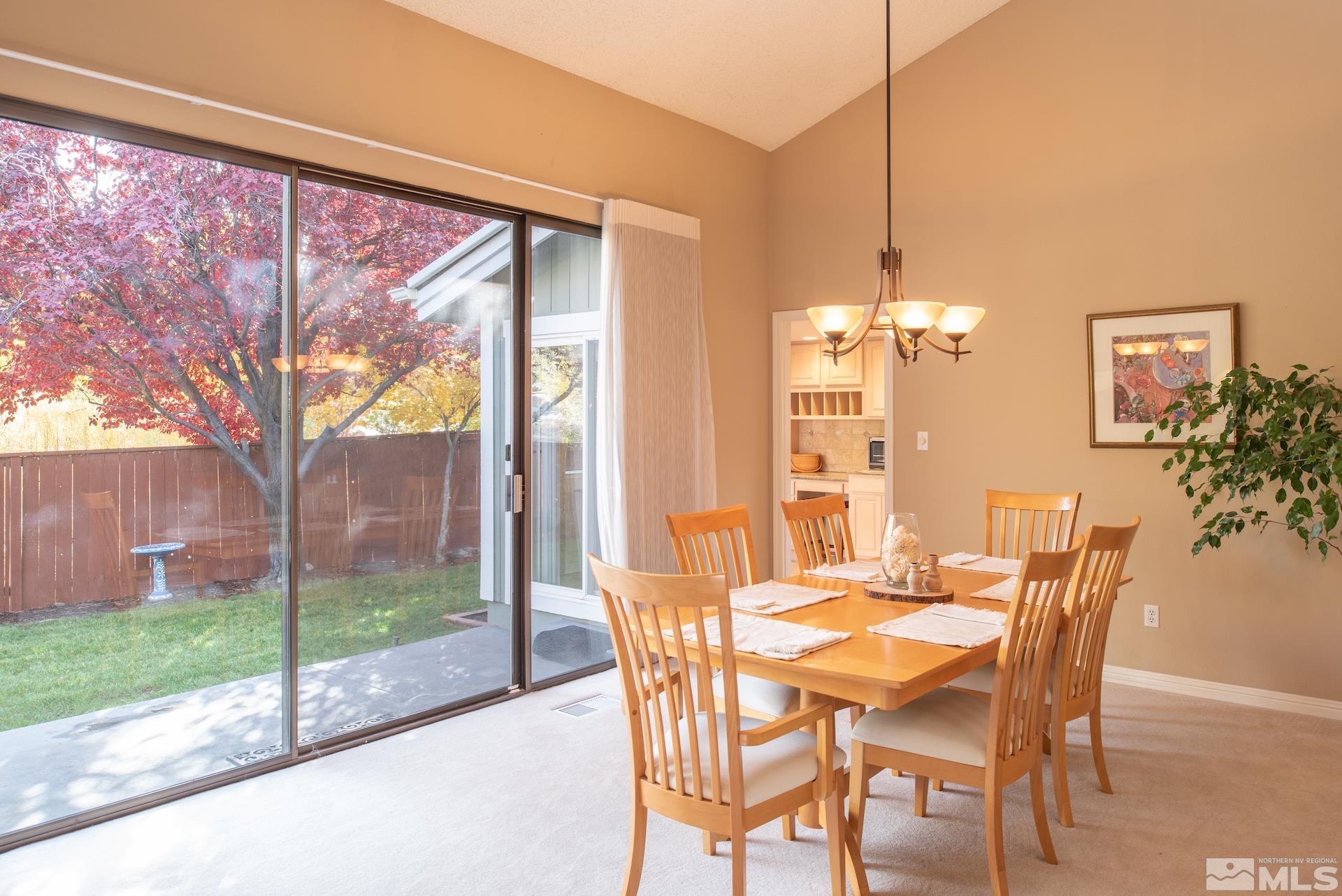 6328 Windy Meadow Drive Reno, NV 89519 - Photo 4 of 35 a dining room with furniture and garden view