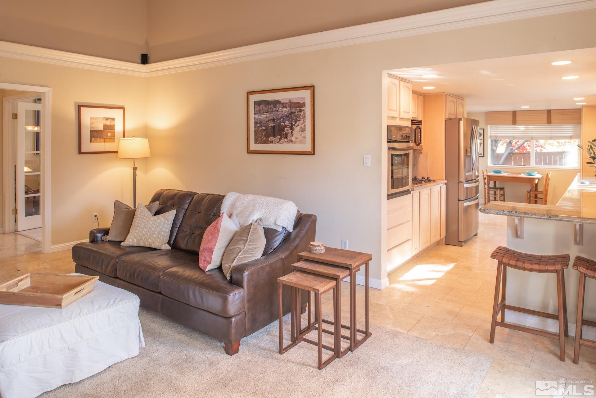 6328 Windy Meadow Drive Reno, NV 89519 - Photo 7 of 35 a living room with furniture and a kitchen view
