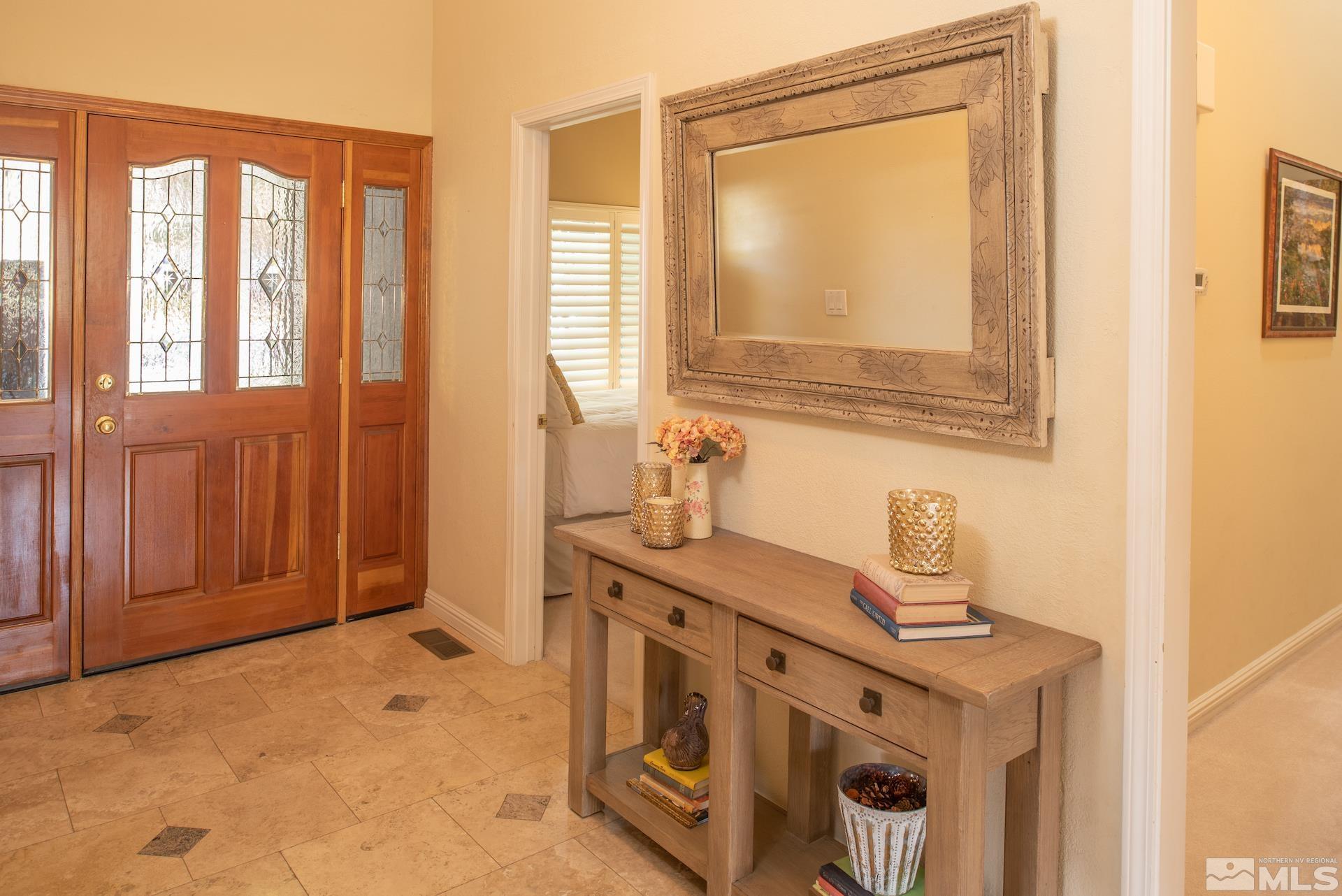 6328 Windy Meadow Drive Reno, NV 89519 - Photo 10 of 35 a view of a bathroom with two sinks and a window