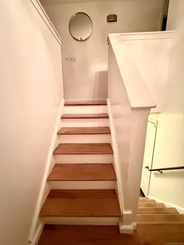 a view of staircase with white walls