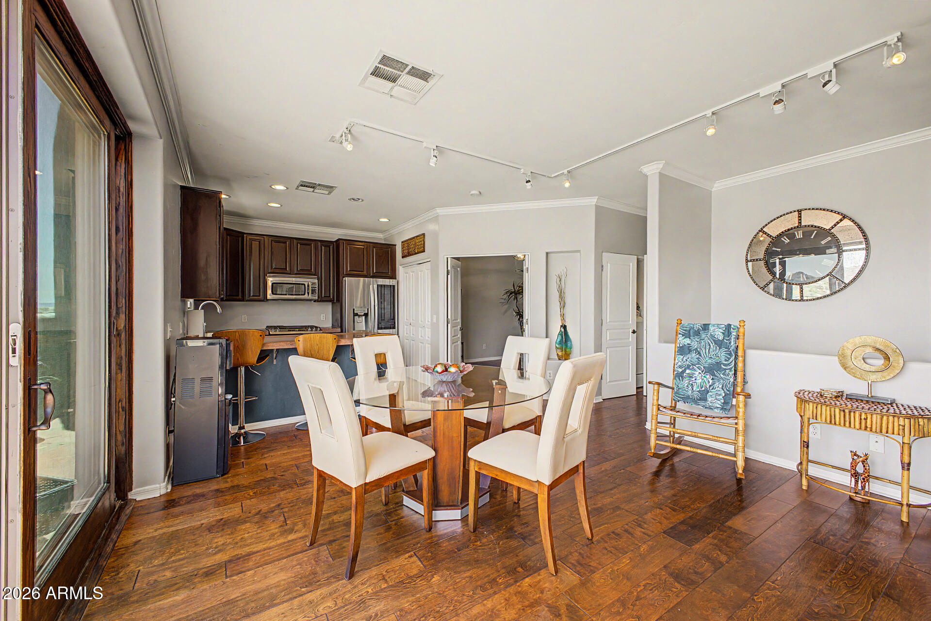 10009 North 1st Drive Phoenix, AZ 85021 - Photo 6 of 15 a dining room with furniture a window and wooden floor